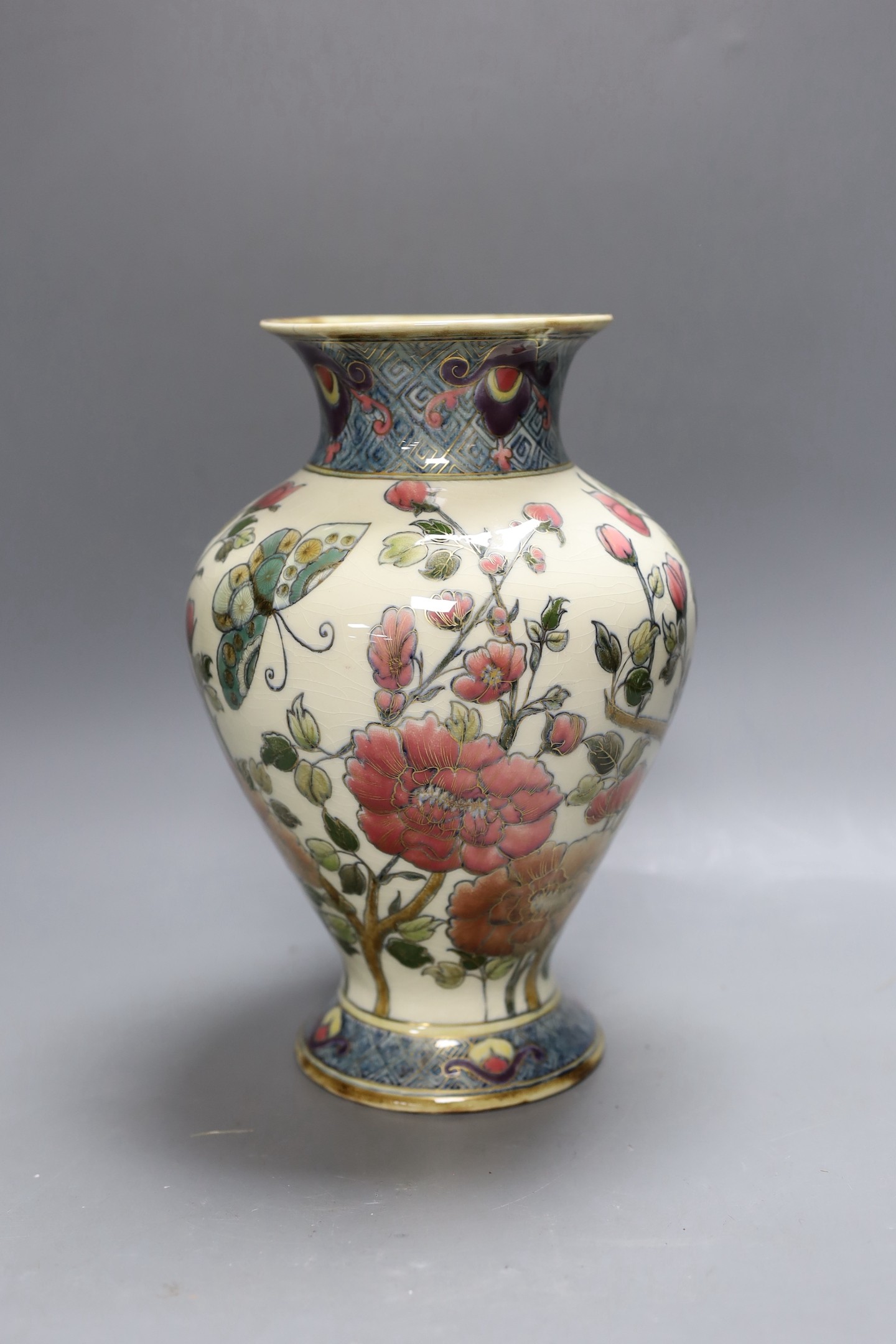An early 20th century Zsolnay Persian style pottery vase. 26cm tall